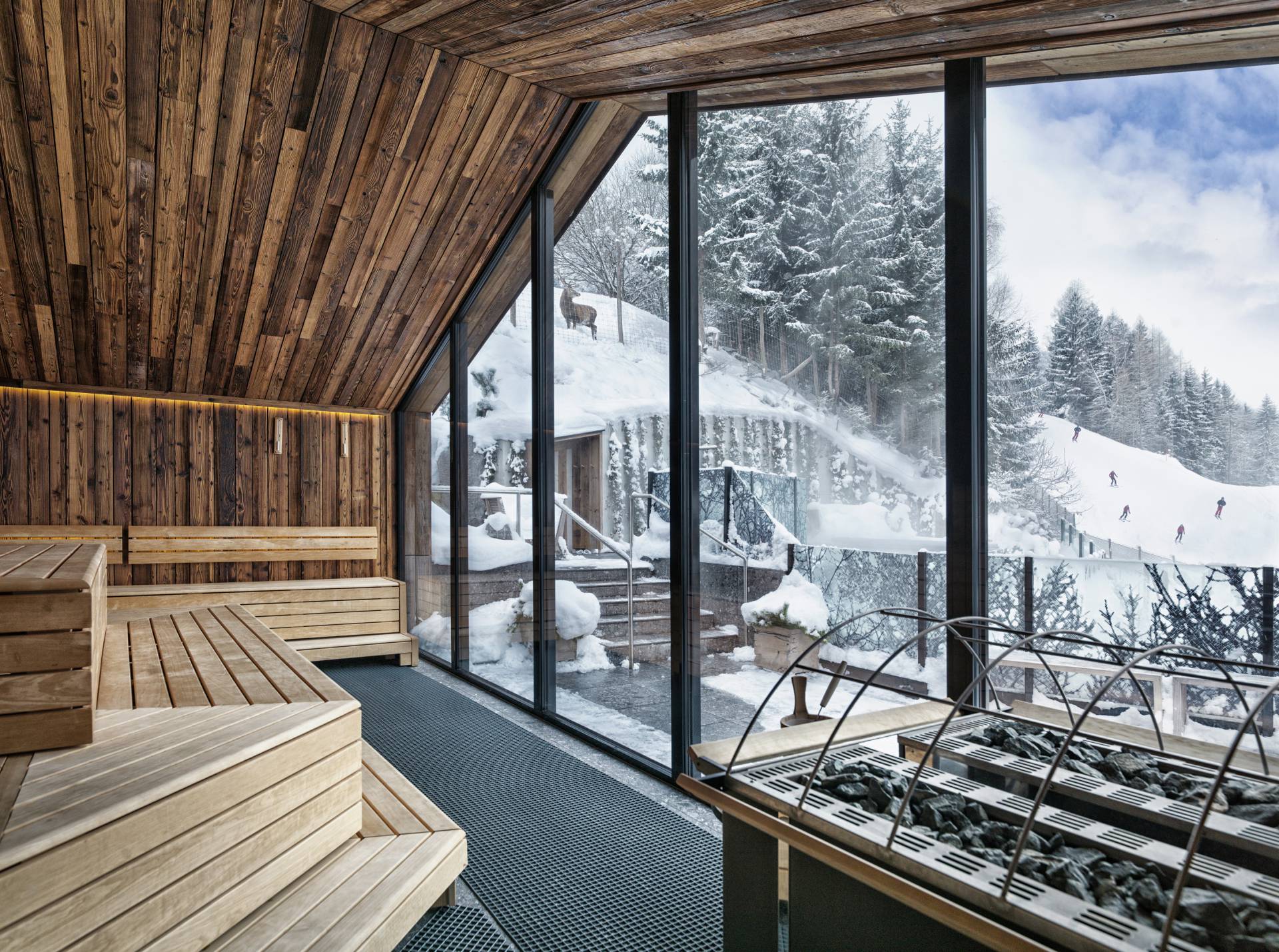 Outdoor pool overlooking ski slope in winter